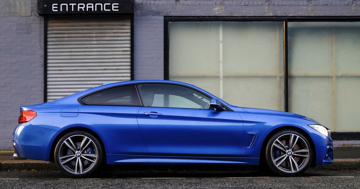 Modern car dashboard with tech upgrades including dash cam, phone mount, and Bluetooth adapter